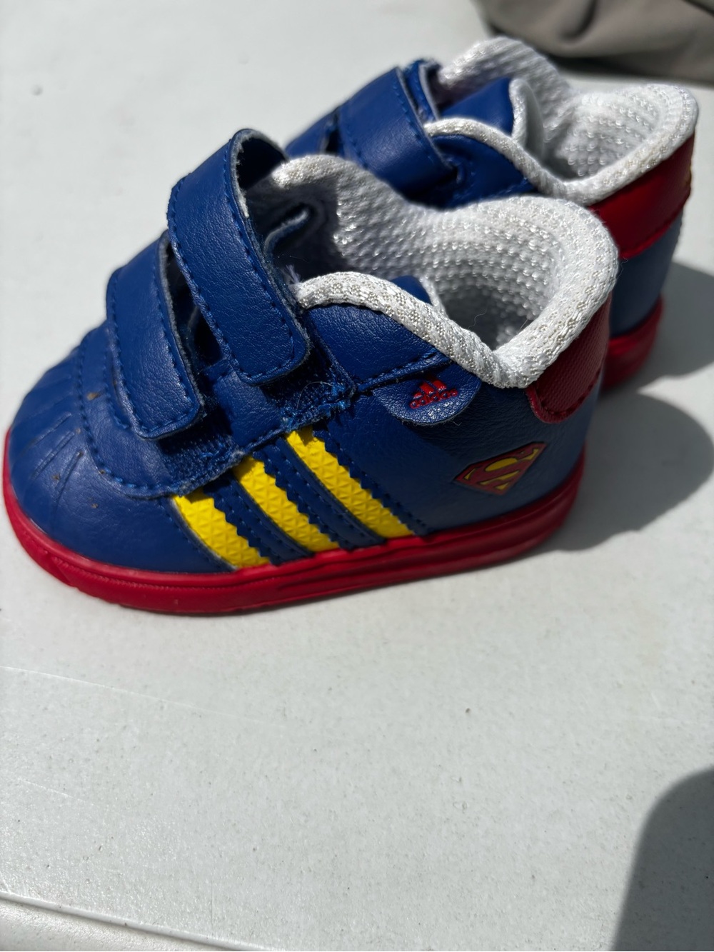 adidas Kids Blue Sneaker with Yellow Stripes and Red Accents